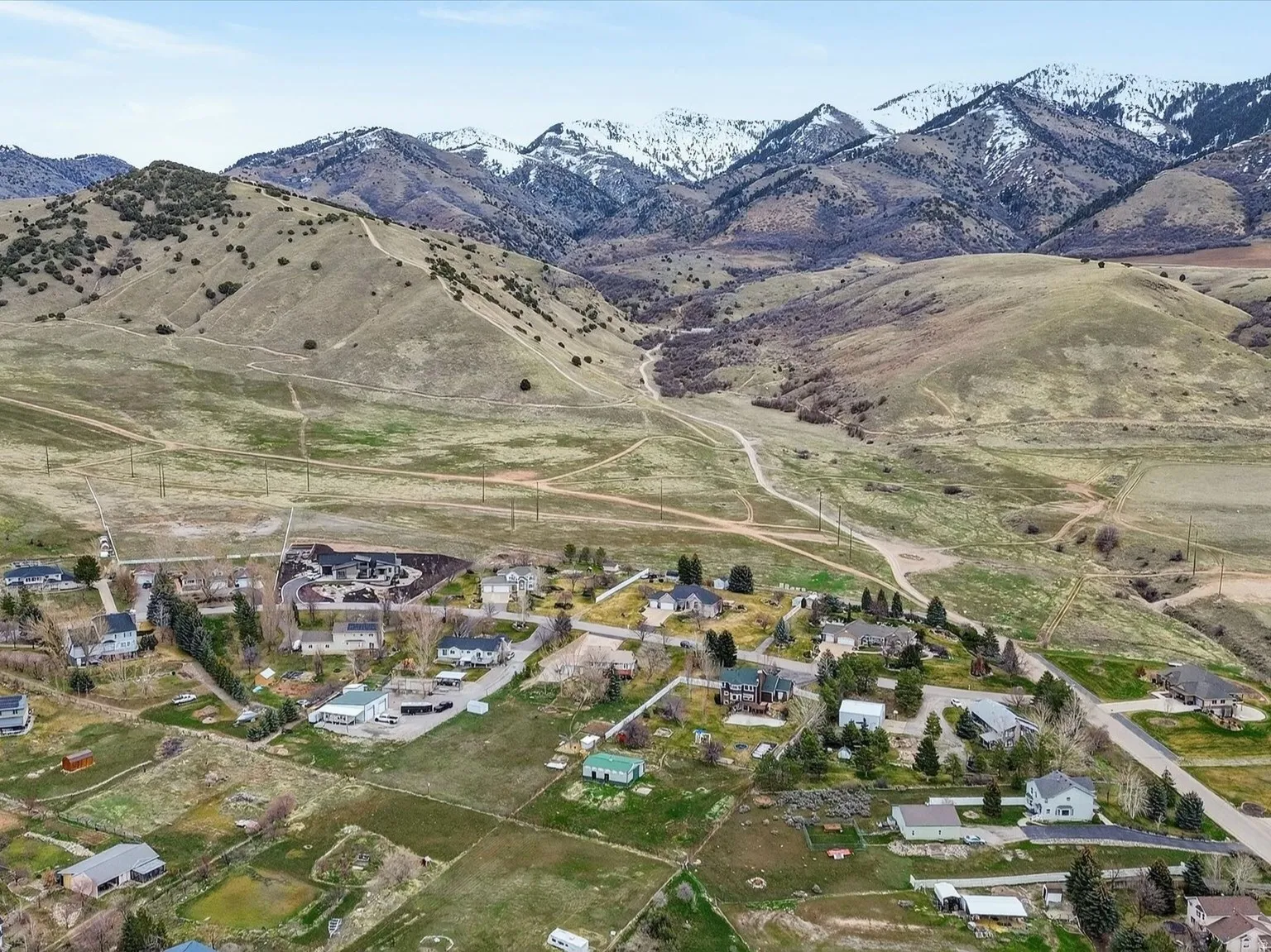 Aerial view of residential area featuring mountains