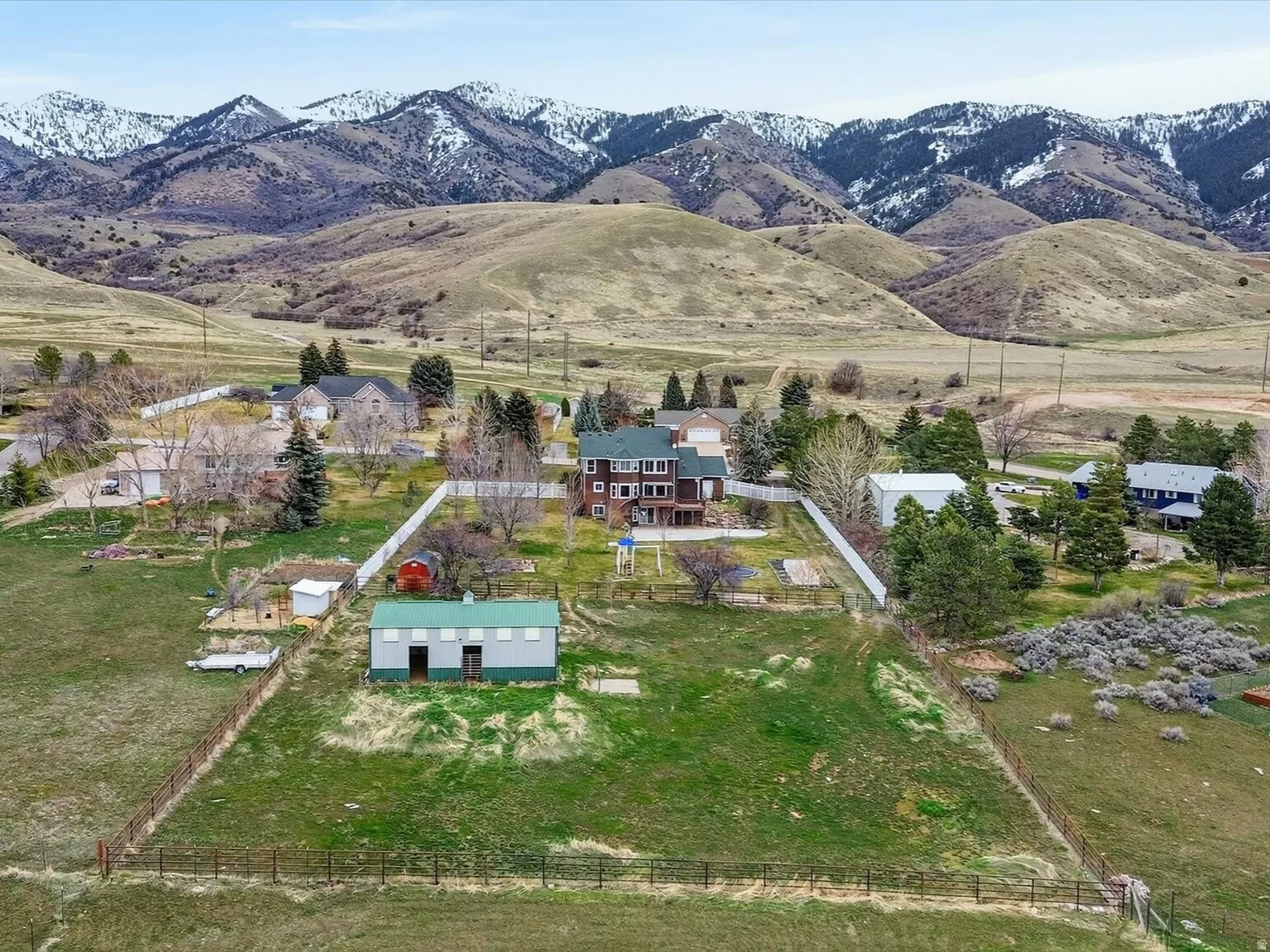Aerial overview of property's location with rural landscape and nearby suburban area