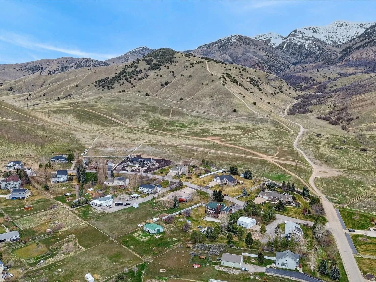 Aerial view of residential area featuring a mountainous background