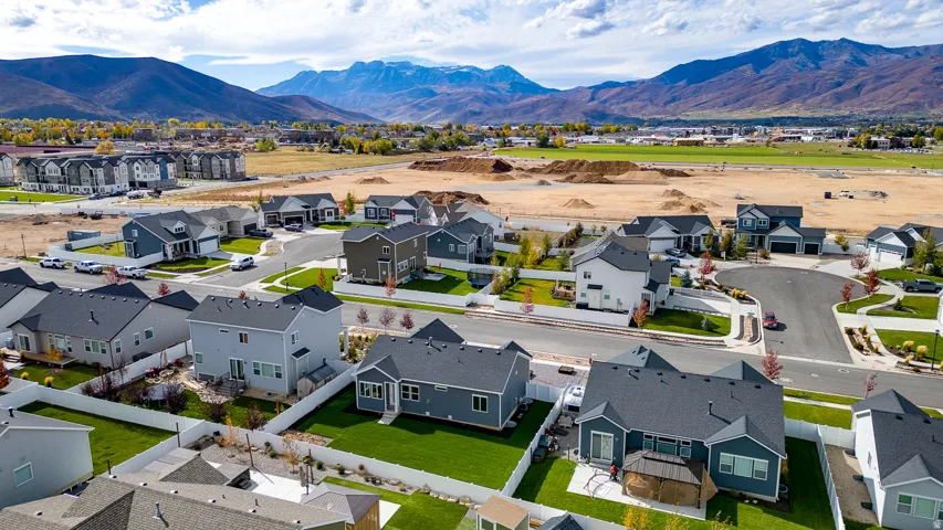 Aerial view of residential area featuring a mountain backdrop