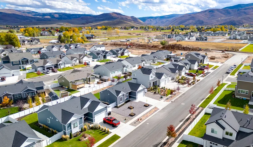 Aerial view of residential area featuring mountains
