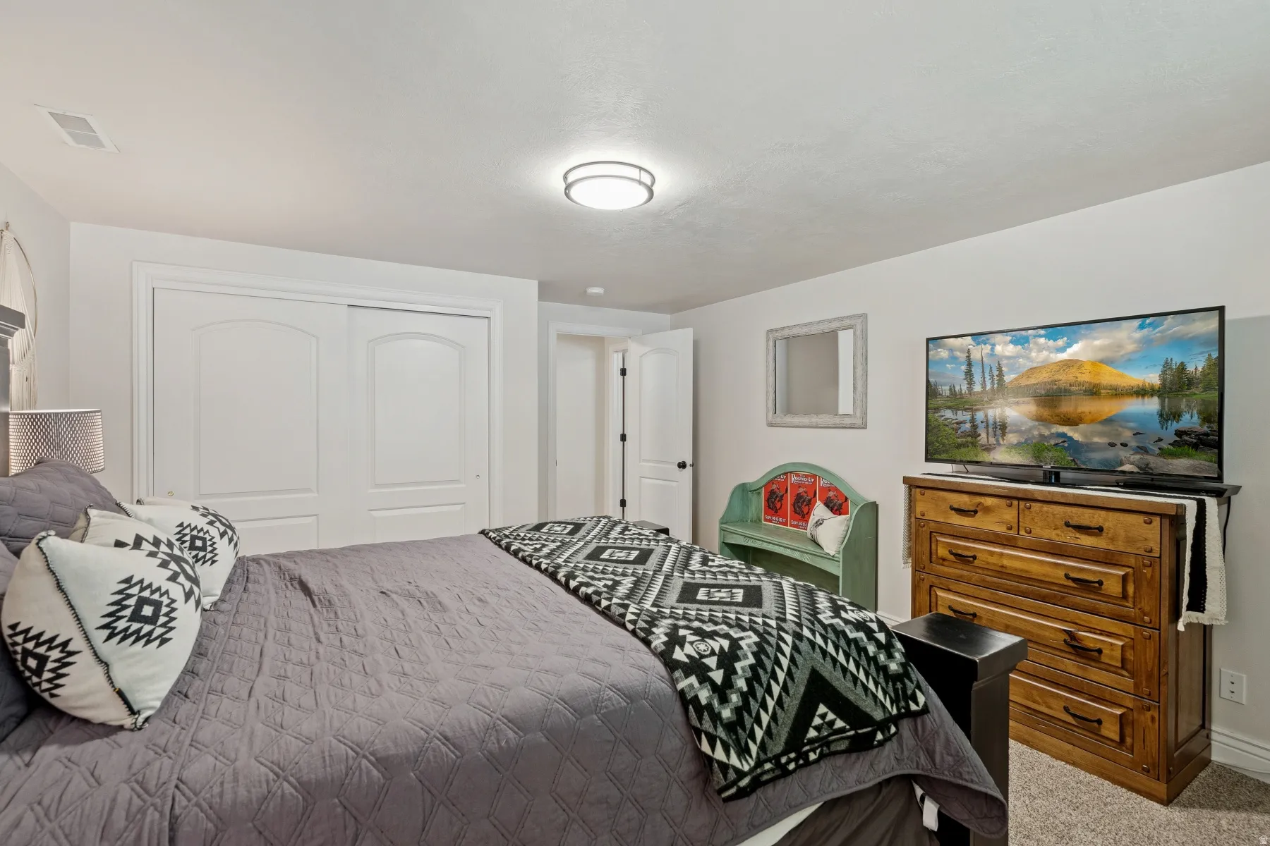 Bedroom with a closet and light carpet