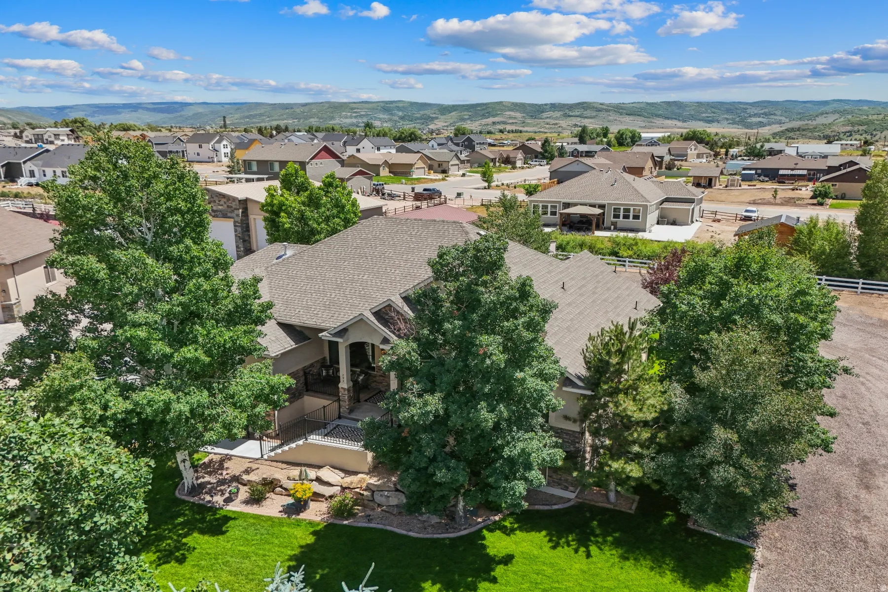 Aerial perspective of suburban area with a mountainous background