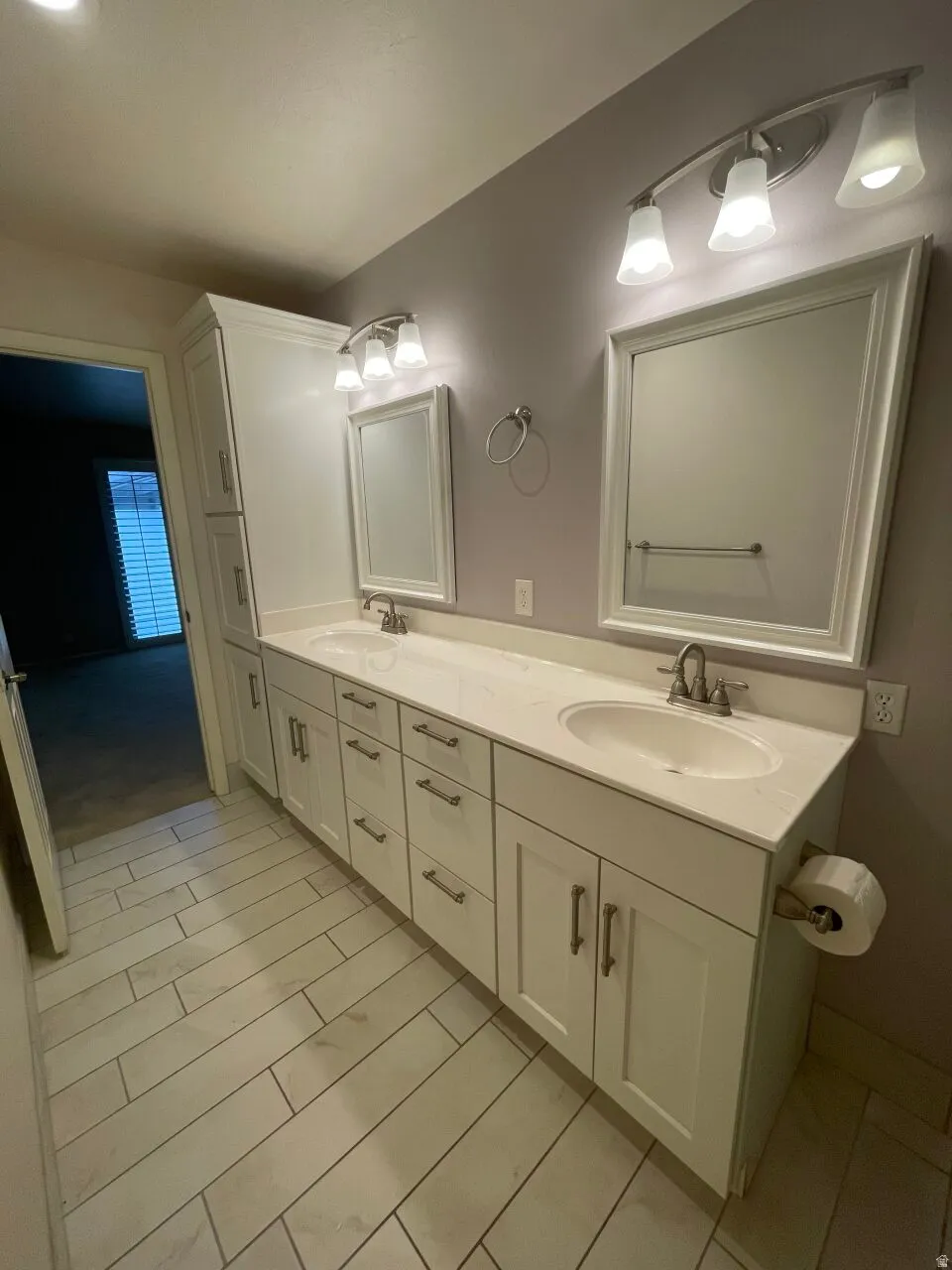 Full bath featuring double vanity