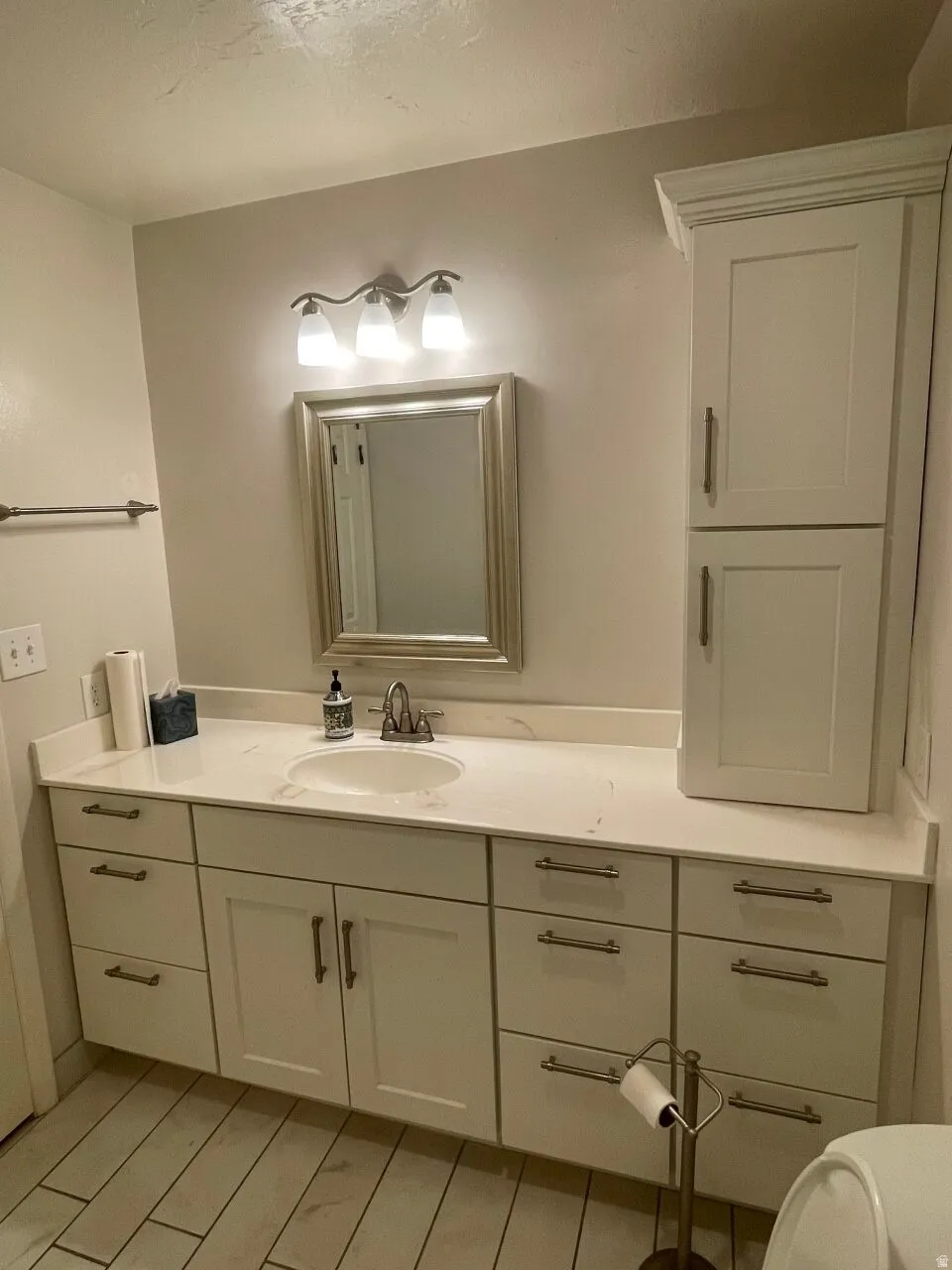 Bathroom featuring vanity and light wood-style floors
