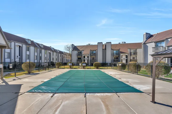 Community pool featuring a residential view