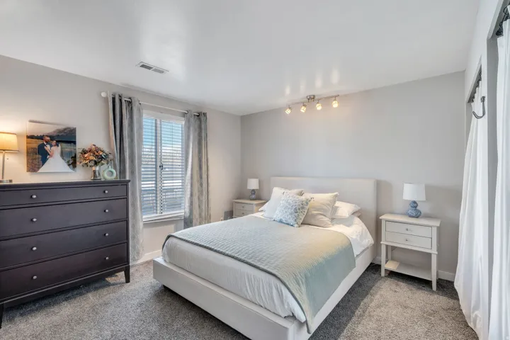 Bedroom with carpet flooring and baseboards