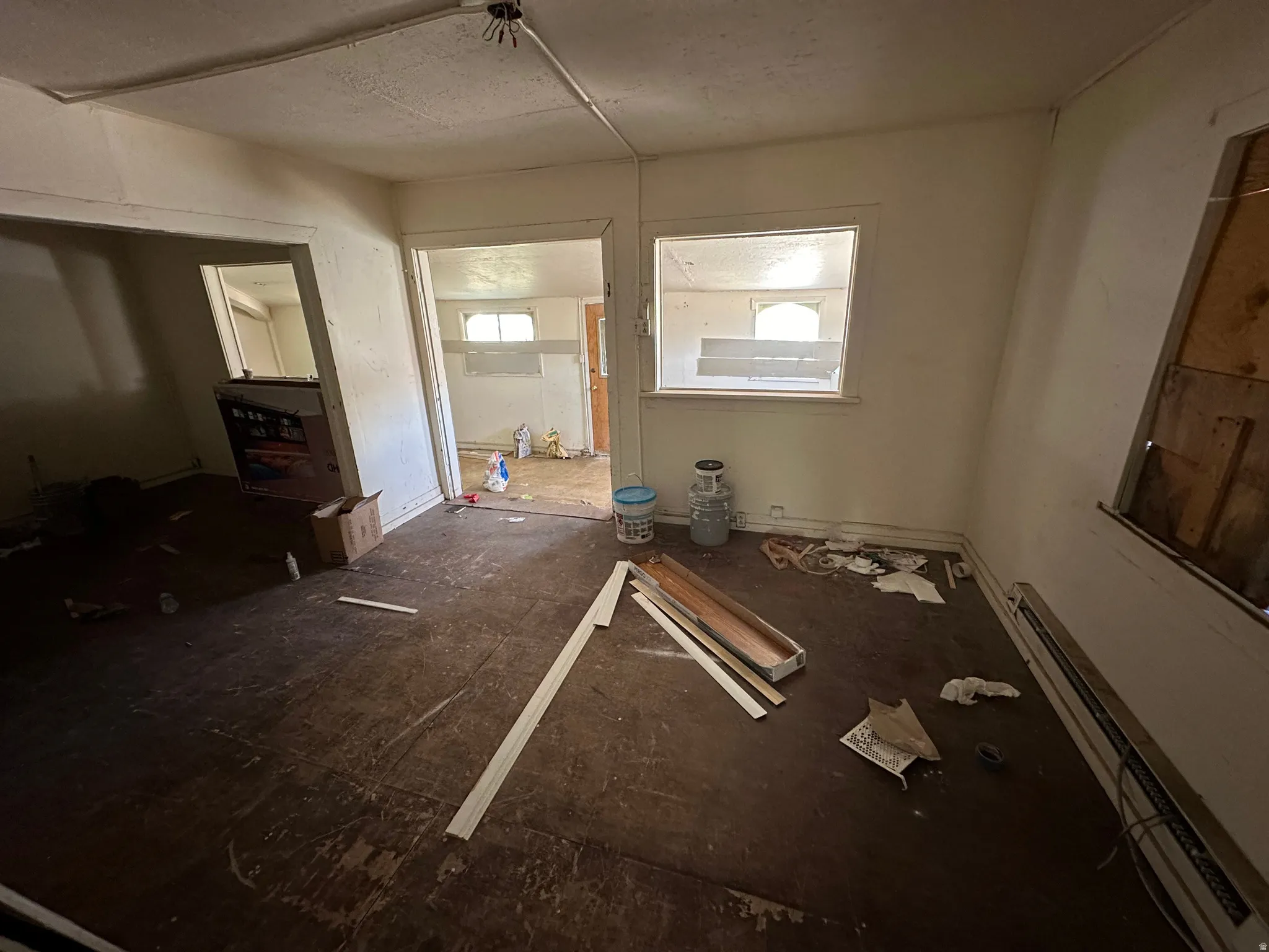 Unfurnished room featuring baseboard heating