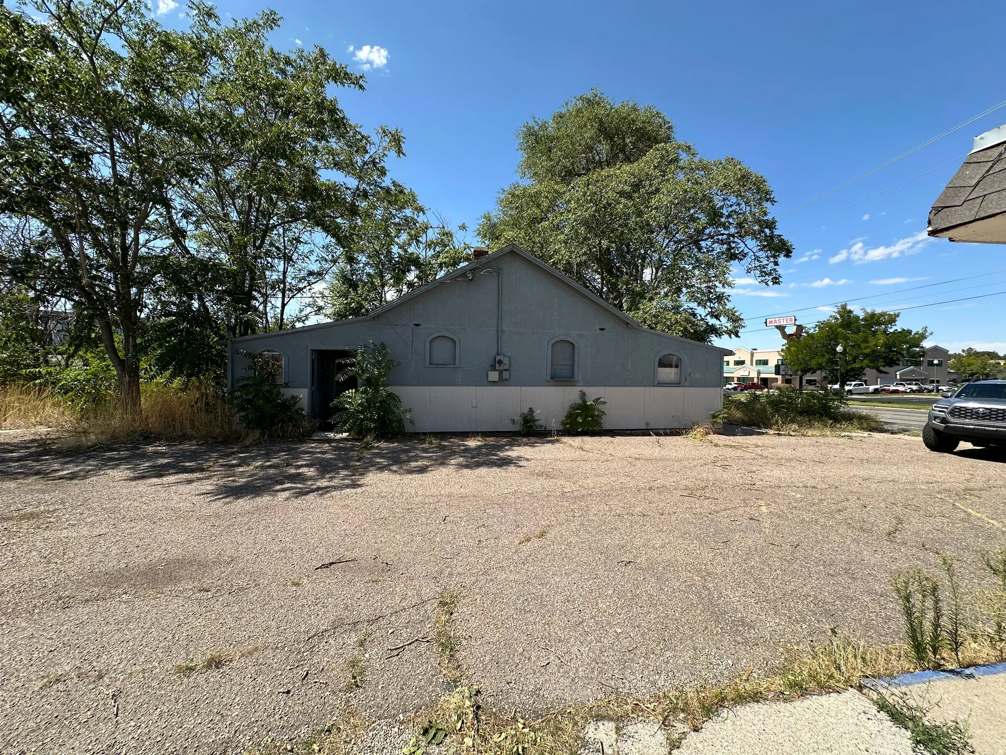 View of side of property featuring stucco siding