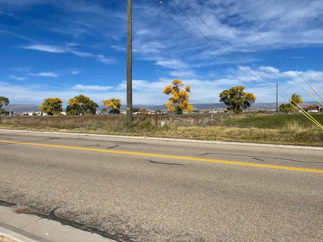 View of asphalt street with curbs