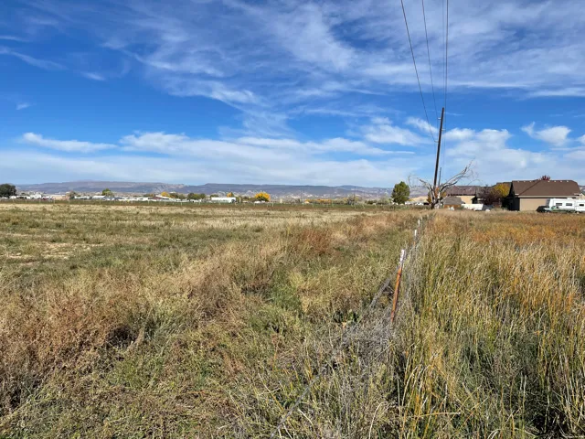 View of yard with a rural view
