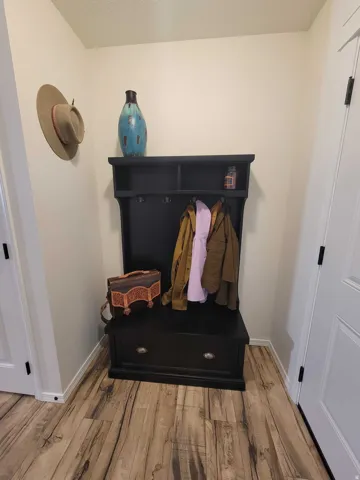 Mudroom featuring l