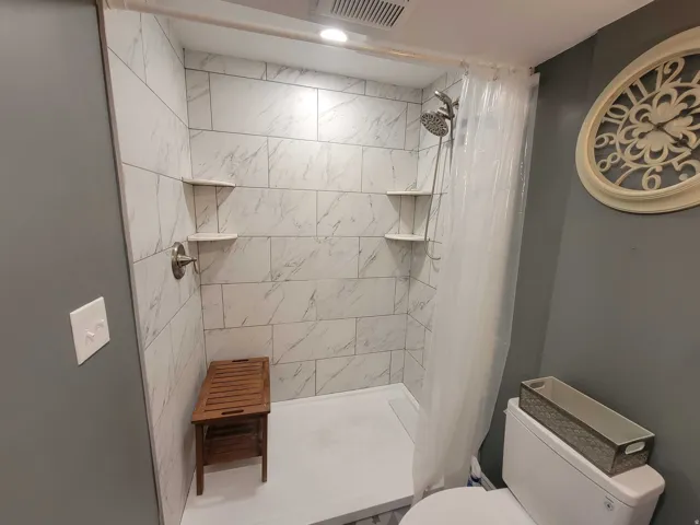 Bathroom with toilet and a shower stall
