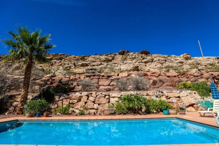 Swimming pool with a tile finish and surrounding hardscaping