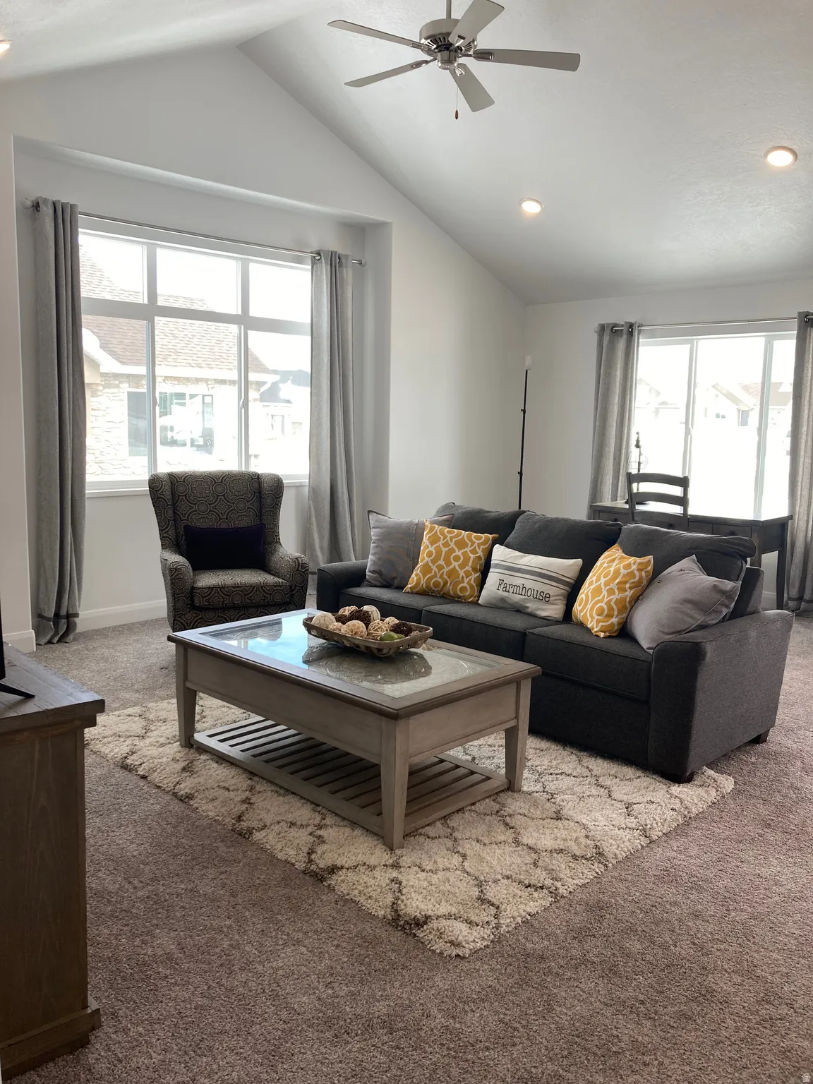 MODEL Carpeted living room with recessed lighting and a ceiling fan