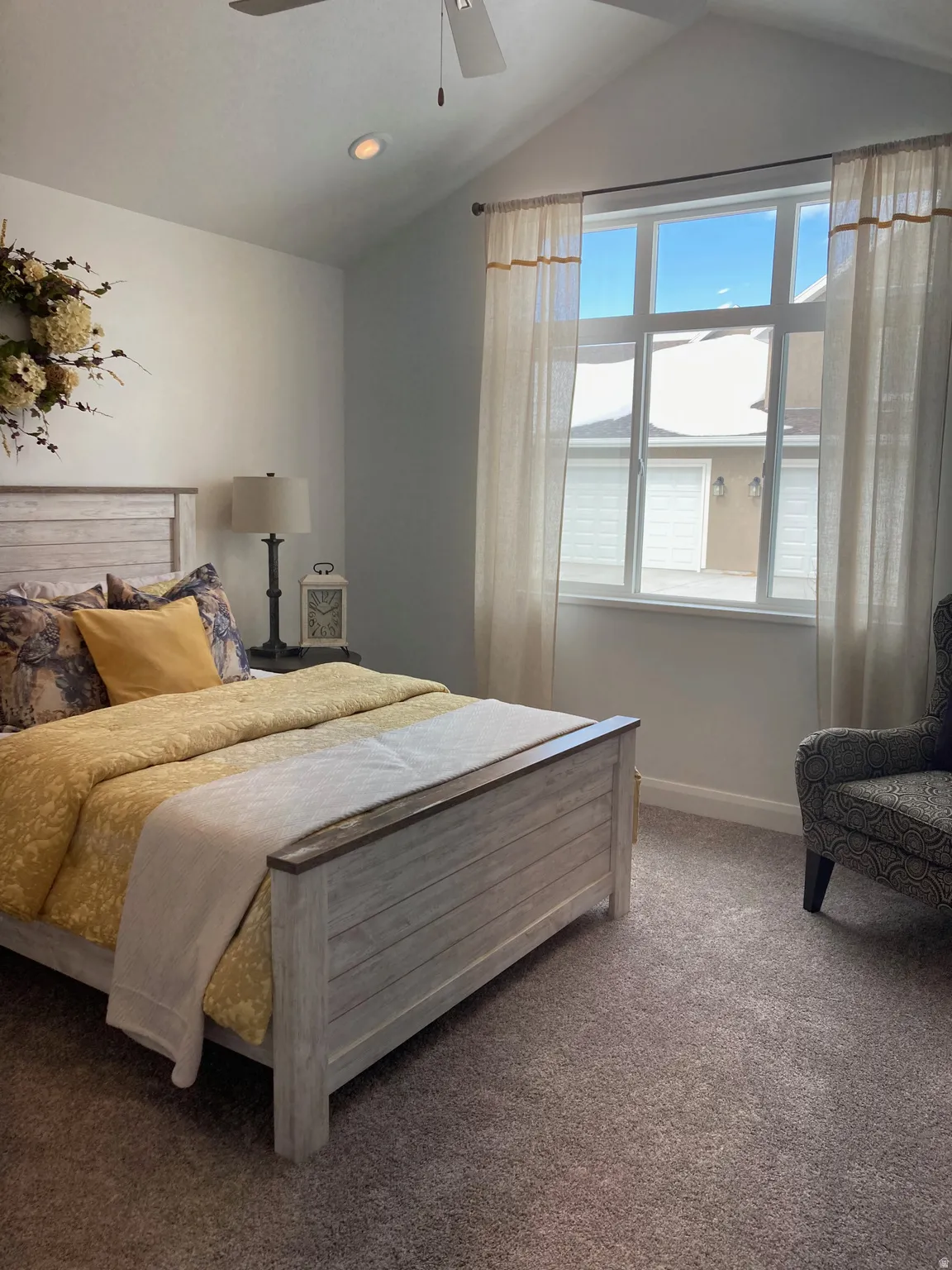 MODEL Carpeted bedroom with baseboards and ceiling fan