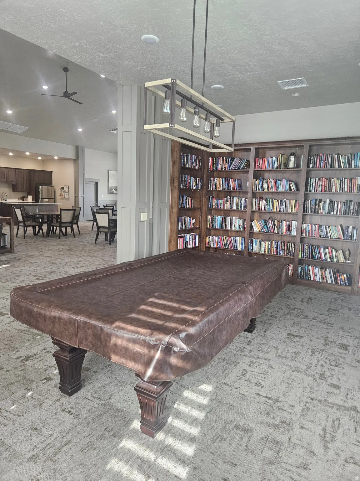 CLUBHOUSE Playroom featuring a textured ceiling and ceiling fan