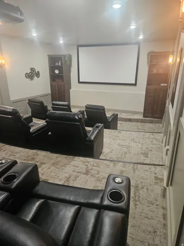 CLUBHOUSE Cinema with carpet, recessed lighting, and a wainscoted wall