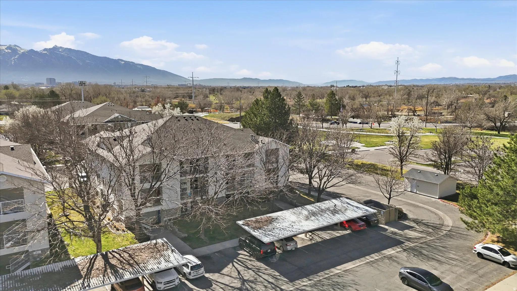 Aerial perspective of suburban area featuring a mountain backdrop