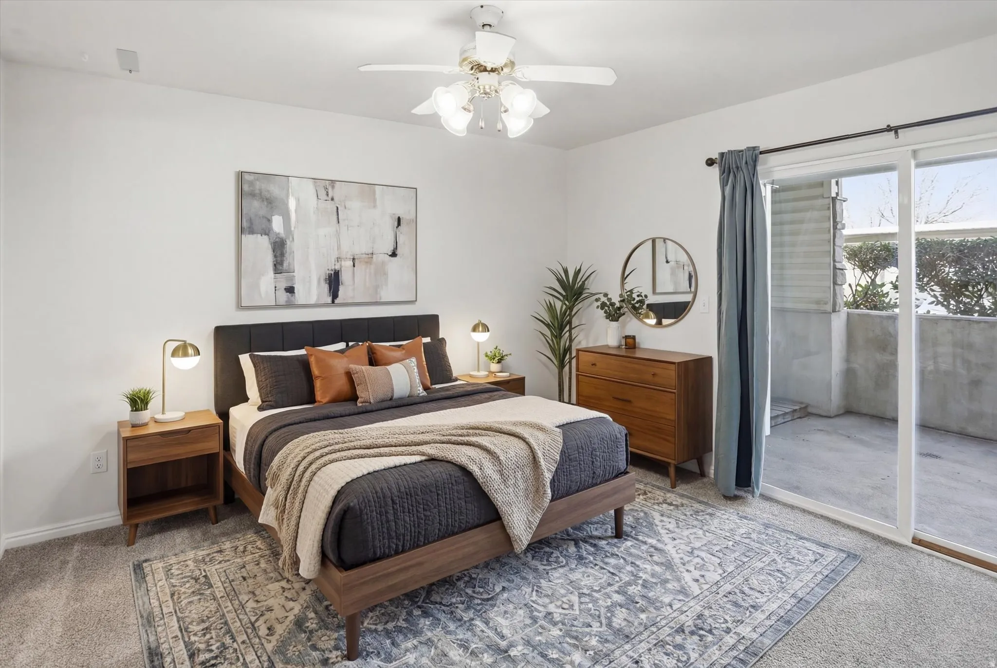Master Bedroom with carpet floors, access to exterior, and ceiling fan