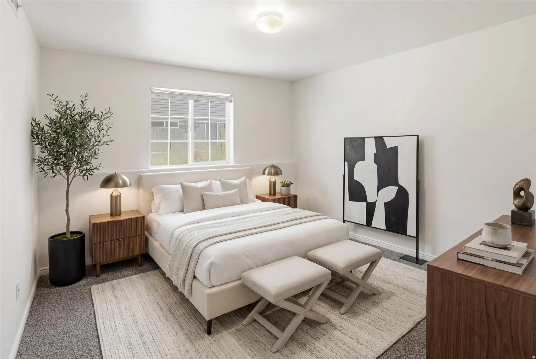 Bedroom featuring light colored carpet and baseboards