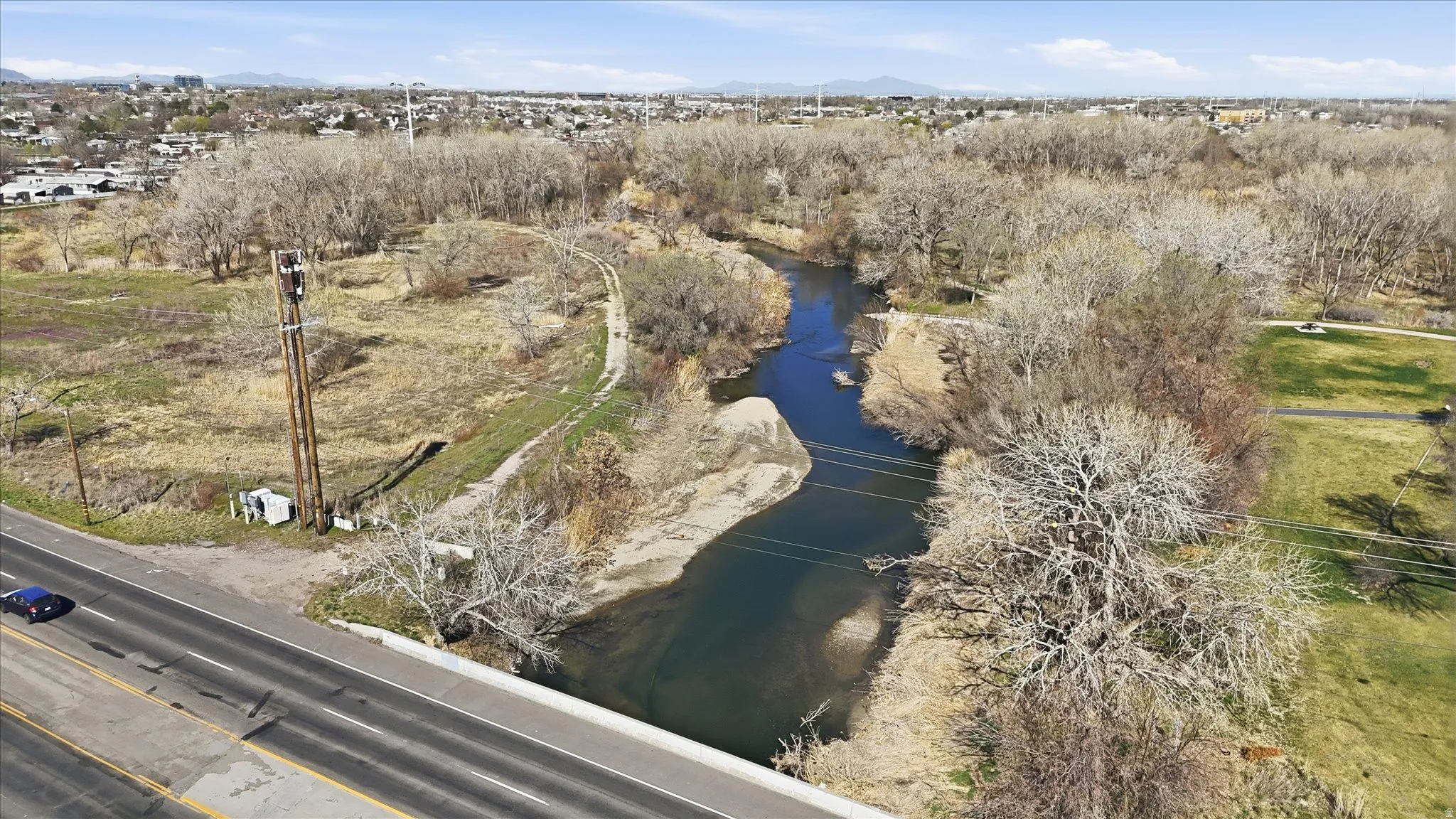 Aerial view of property and surrounding area with a water and mountain view