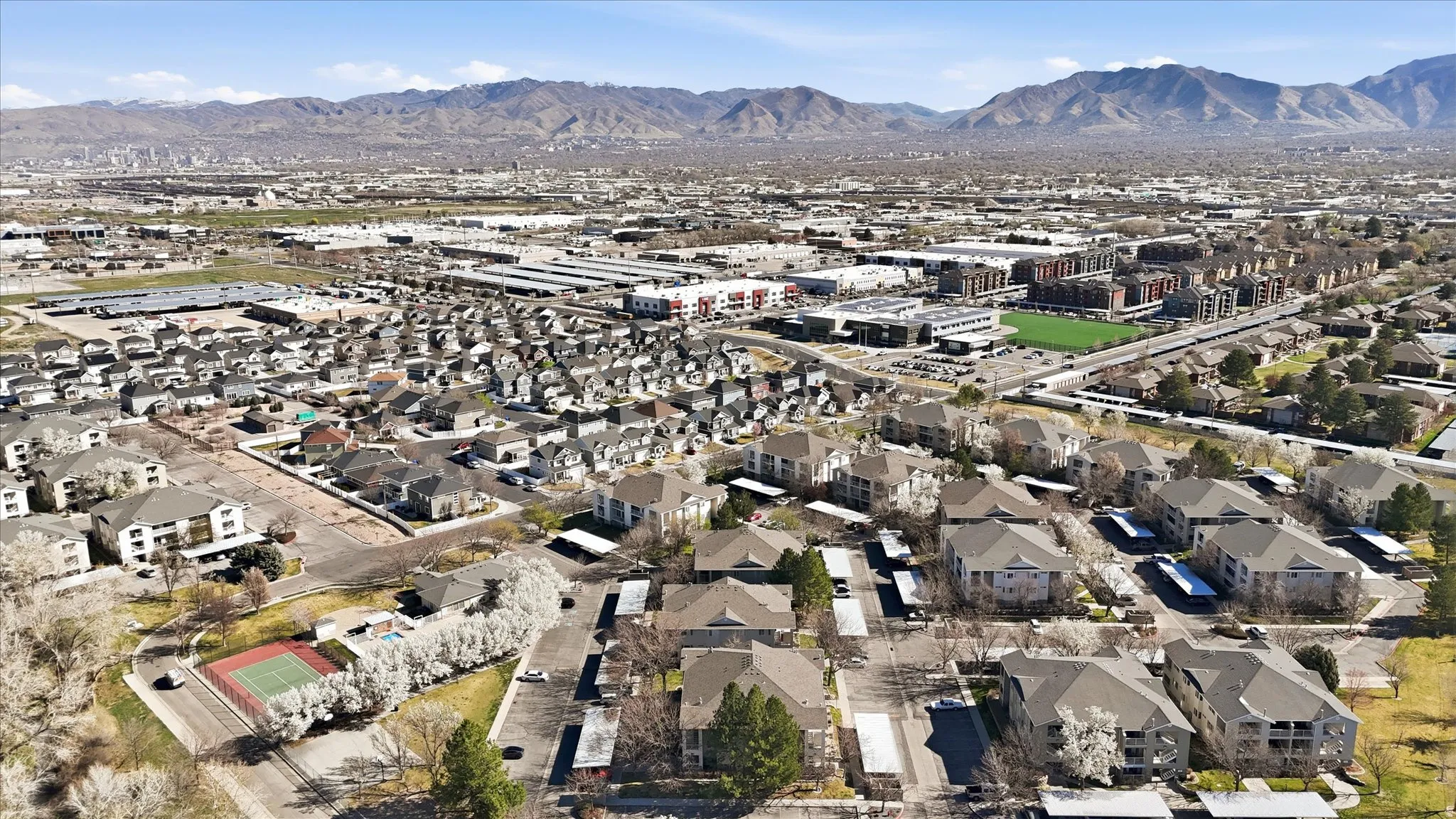 Aerial view of property's location with a mountainous background and nearby suburban area