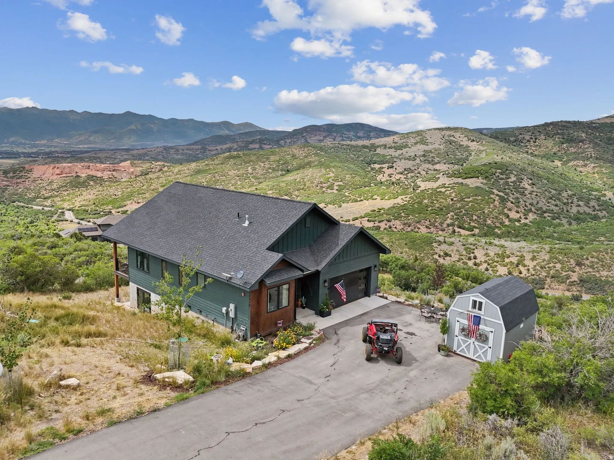 Aerial view of property and surrounding area with mountains
