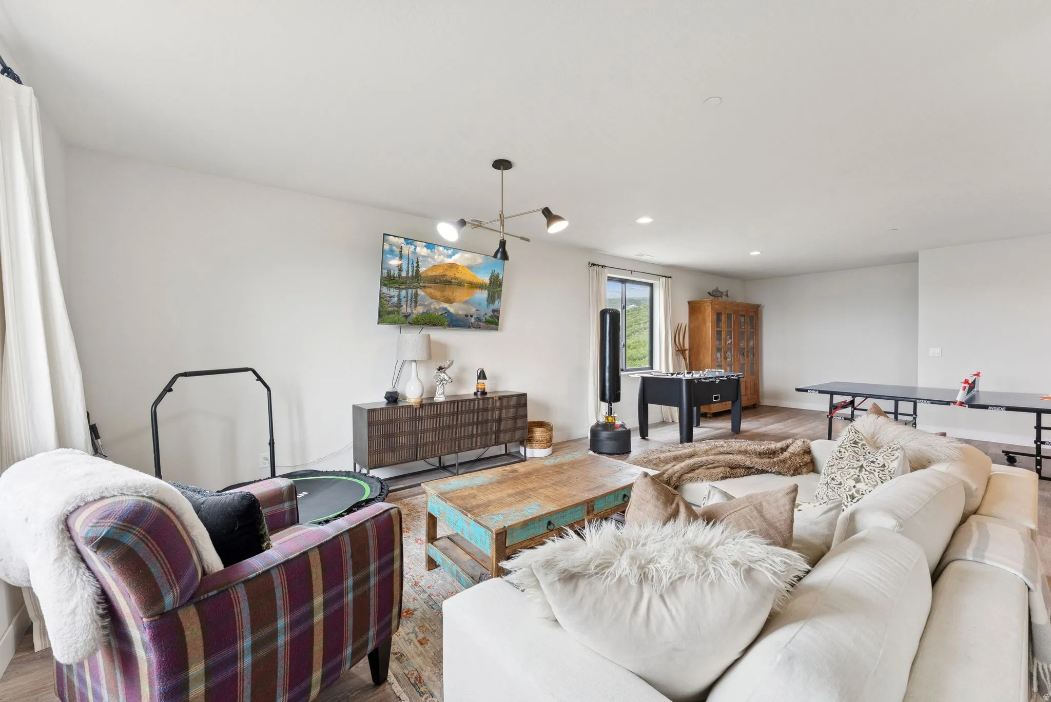 Living room featuring wood finished floors and recessed lighting