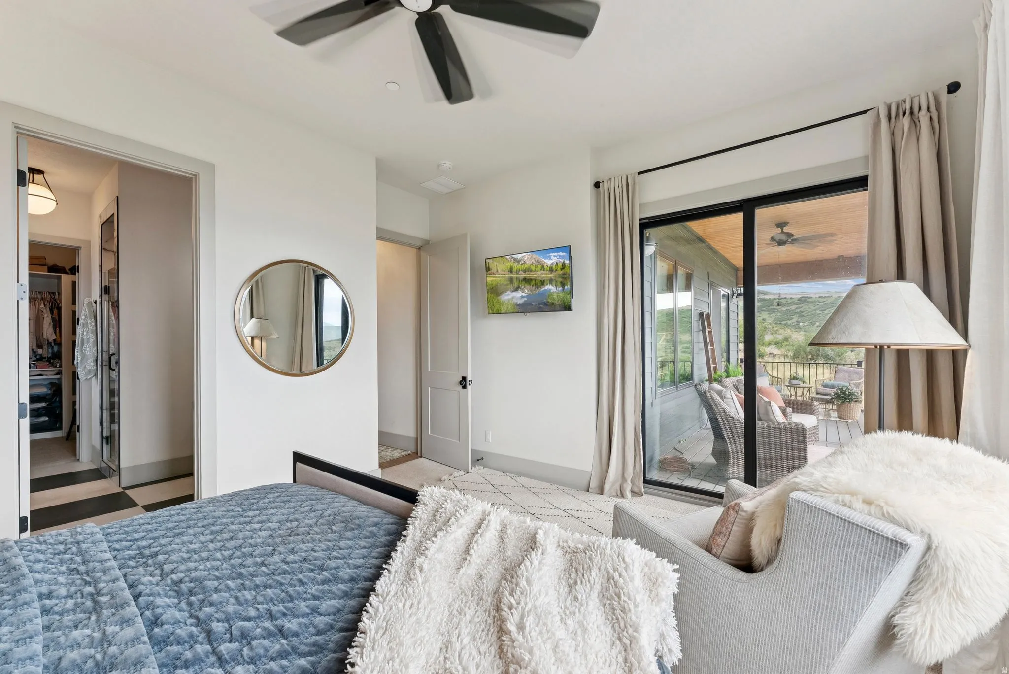 Bedroom with ceiling fan and access to outside