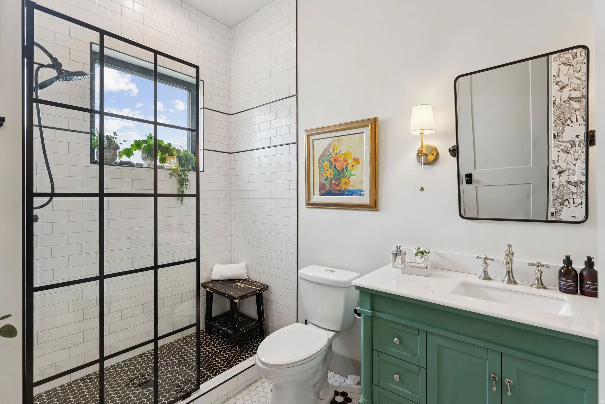 Bathroom featuring vanity and a walk in shower