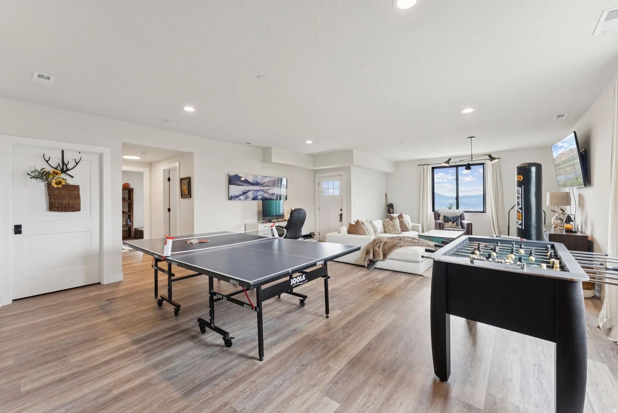 Playroom featuring light wood finished floors and recessed lighting