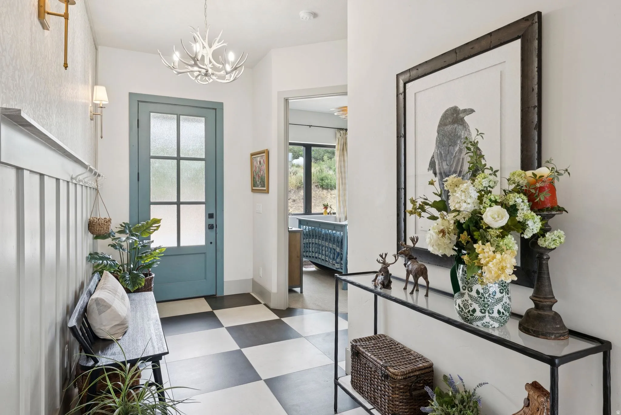 Foyer with dark flooring and a chandelier