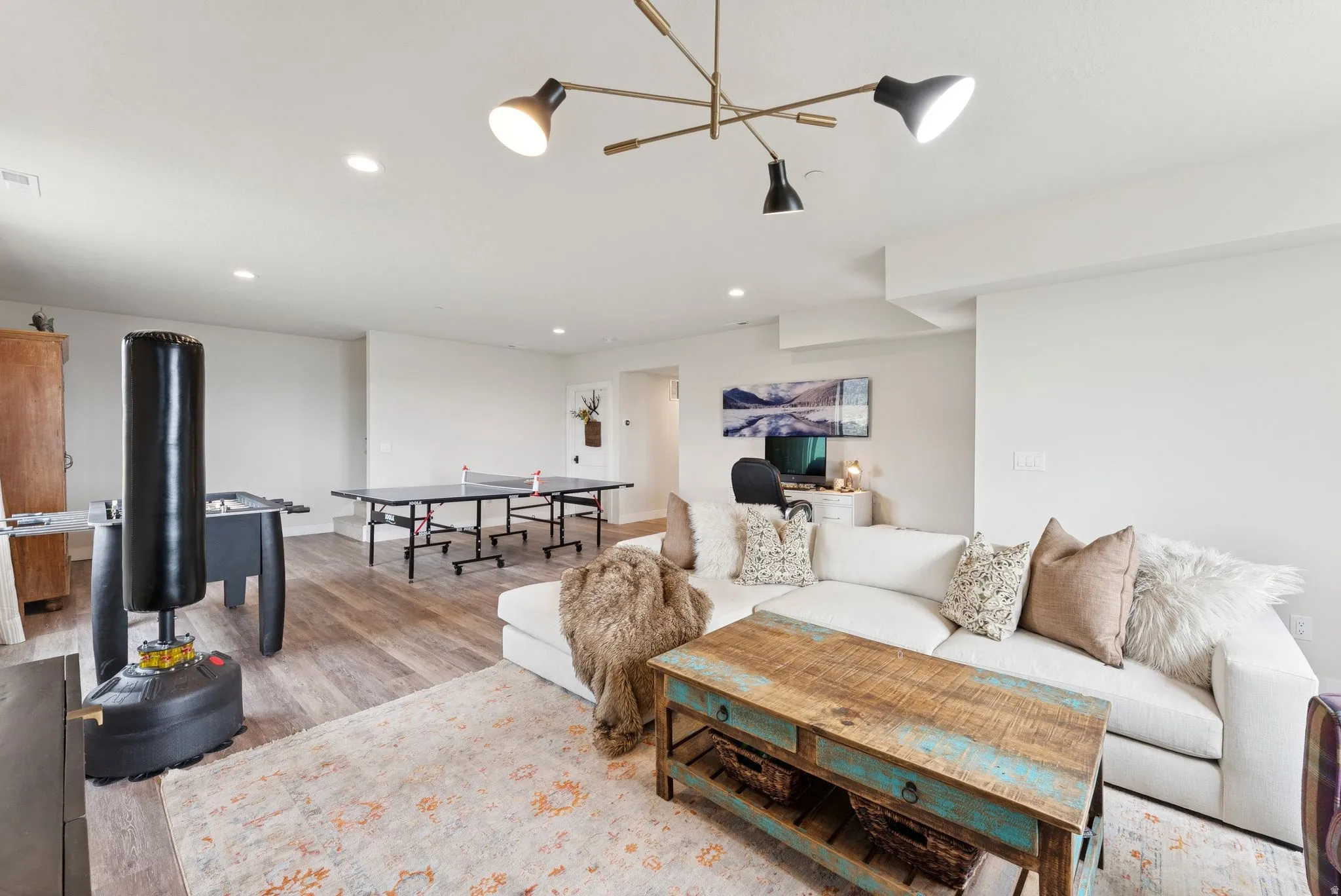 Living room featuring light wood-type flooring and recessed lighting