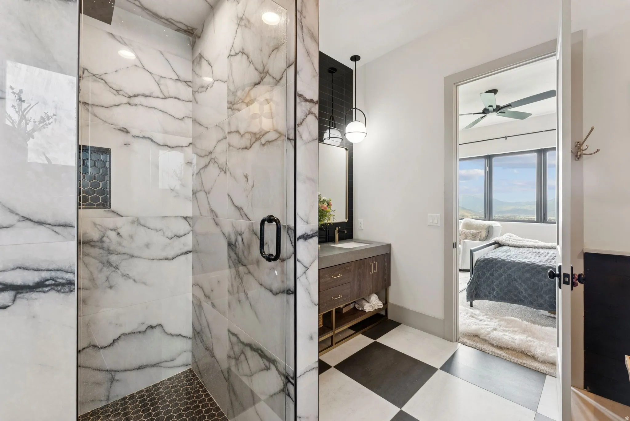 Full bath with ensuite bath, a marble finish shower, vanity, light flooring, and ceiling fan