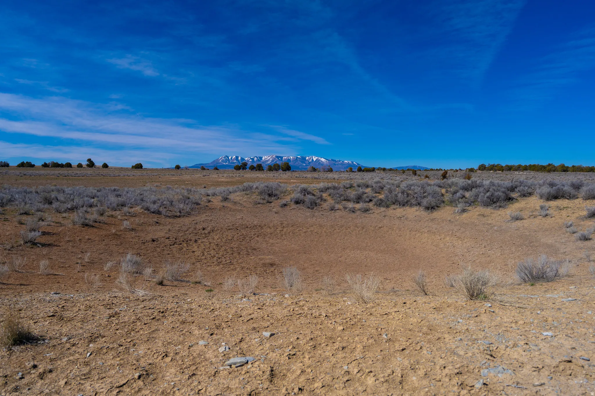 stock pond on north boundary with views of the blue mountains. facing west.