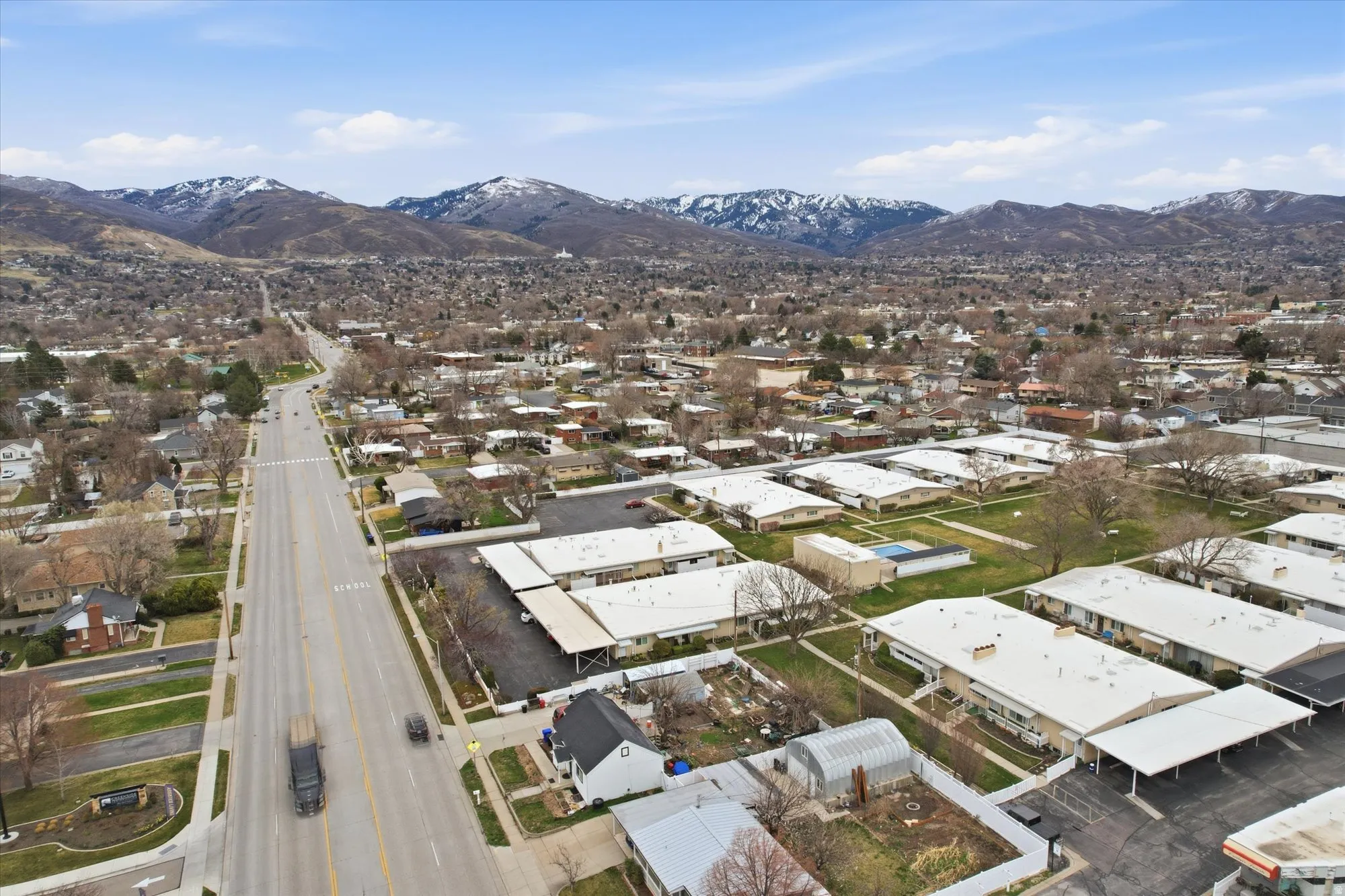 Aerial view of residential area featuring a mountainous background