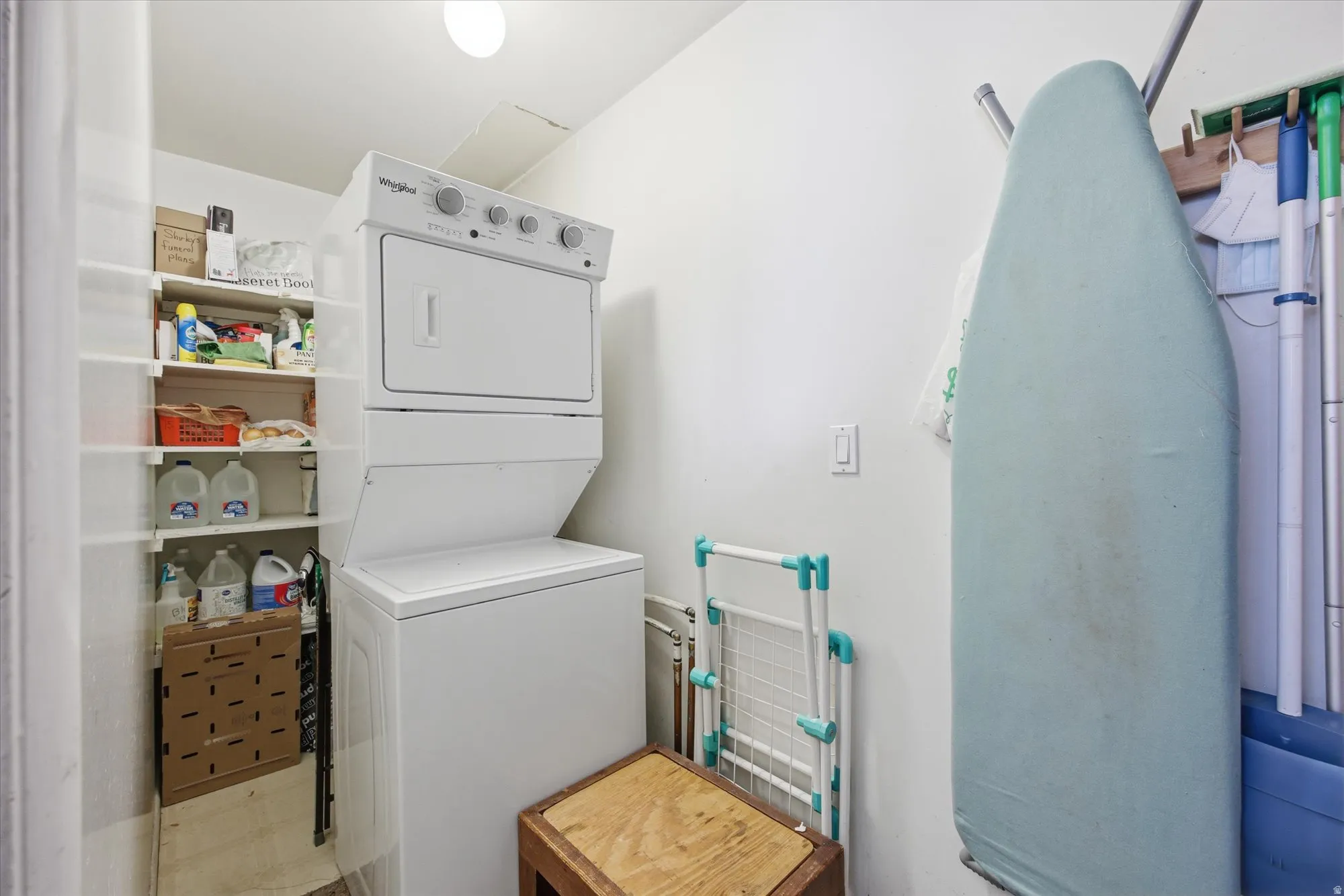 Laundry area with stacked washer / drying machine