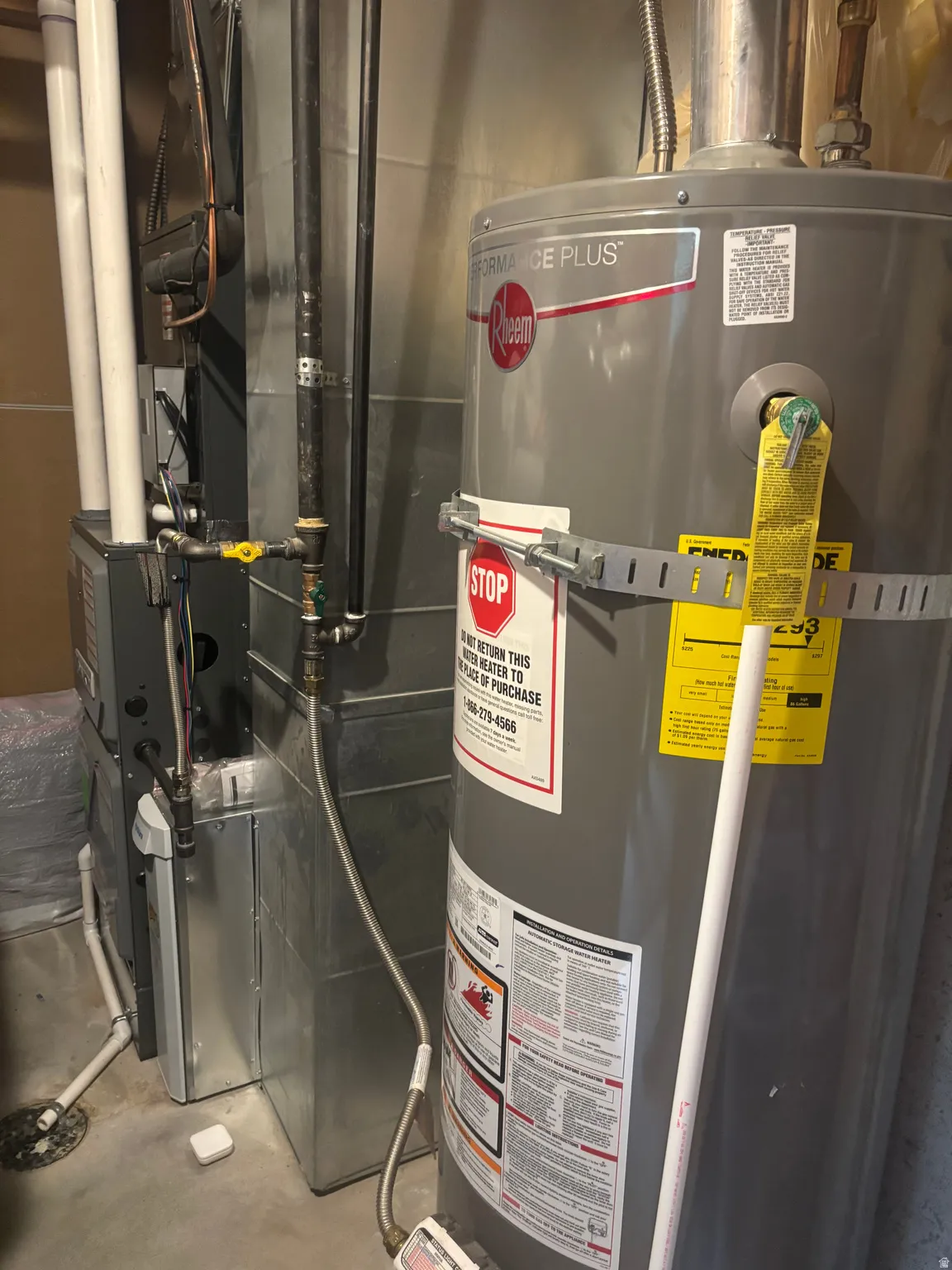 Utilities featuring water heater and heating unit