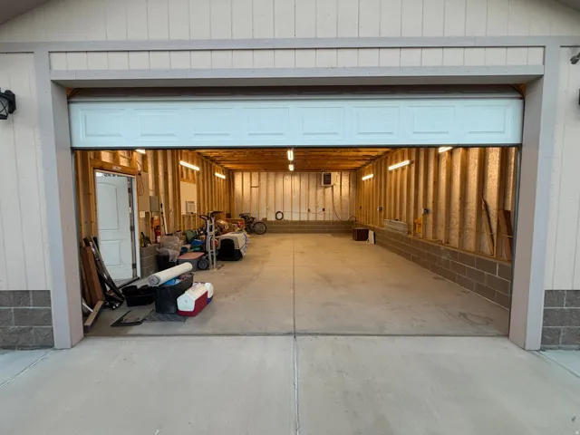 Spacious garage with concrete flooring