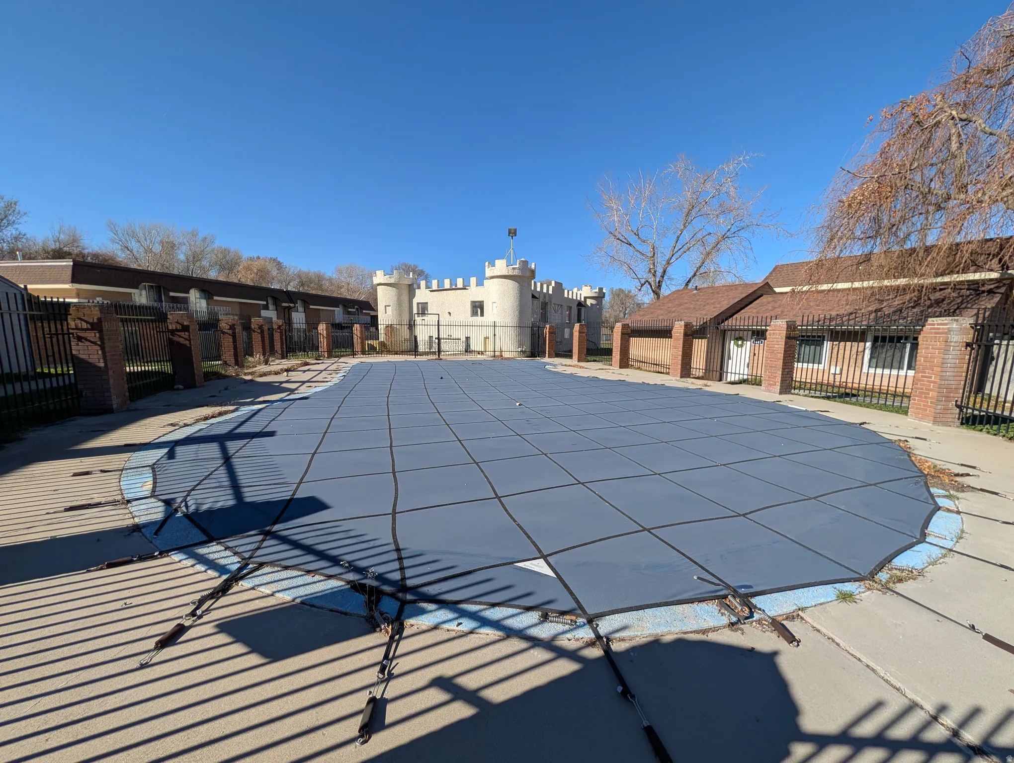 Community pool featuring a residential view