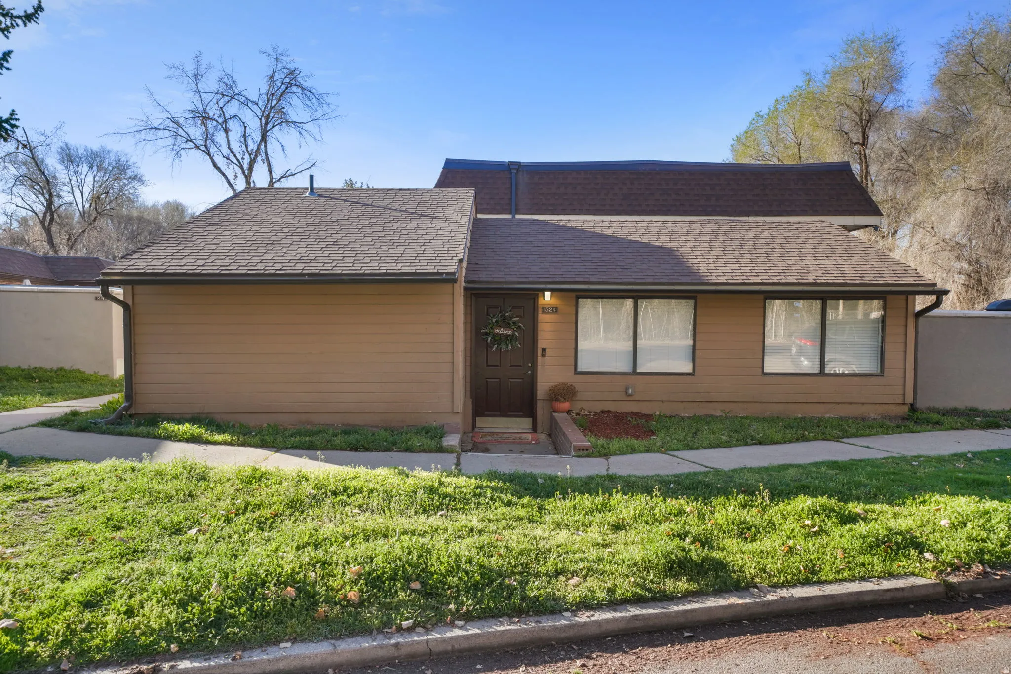 View of front of house with roof with shingles