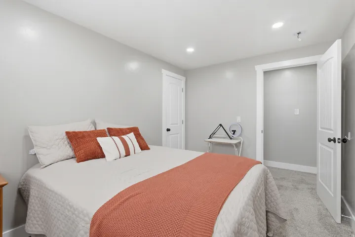 Carpeted bedroom featuring baseboards and recessed lighting