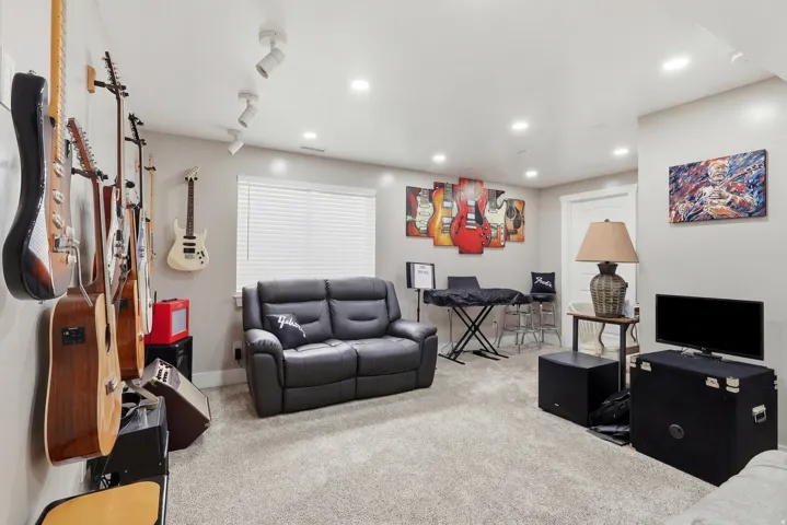 Living room with carpet and recessed lighting