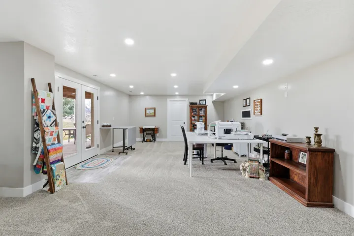 Office area with french doors, light carpet, and recessed lighting