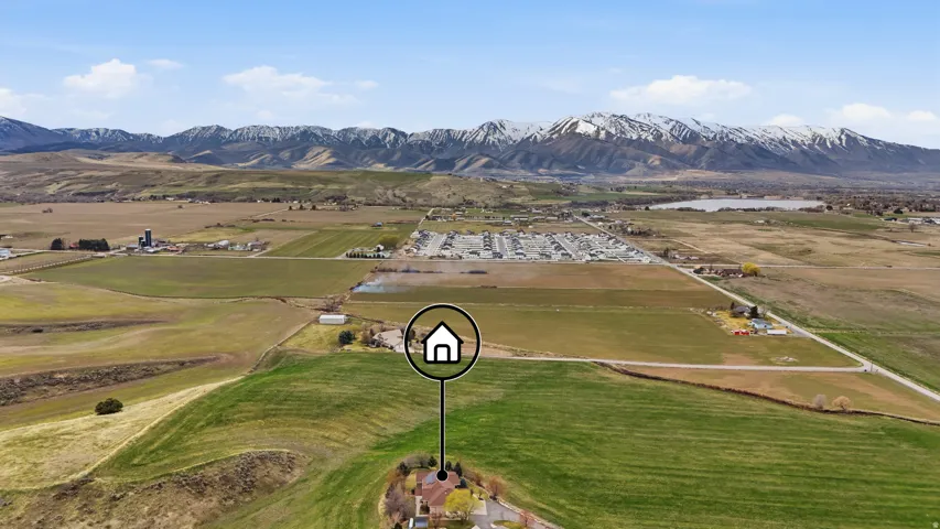 Aerial view of sparsely populated area featuring a mountain backdrop