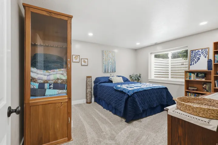 Bedroom featuring carpet floors and baseboards