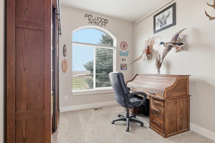 Office space featuring light colored carpet