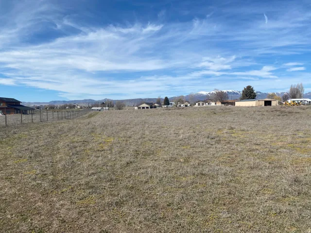 View of yard featuring a mountain view and a view of countryside