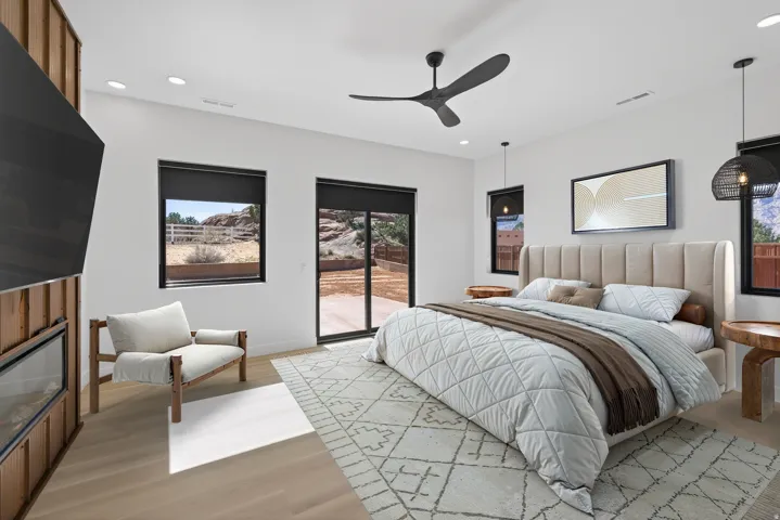 Bedroom with access to outside, light wood-style floors, a ceiling fan, and recessed lighting